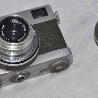 Werra. Includes case and lens cap.