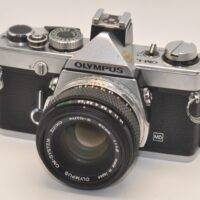 Olympus OM-1N + Zuiko 50mm f1.8 lens. Includes Olympus hot shoe 4.