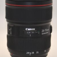 Canon 24-70mm f2.8 L Mark II USM. Includes hood, caps, box, and case.